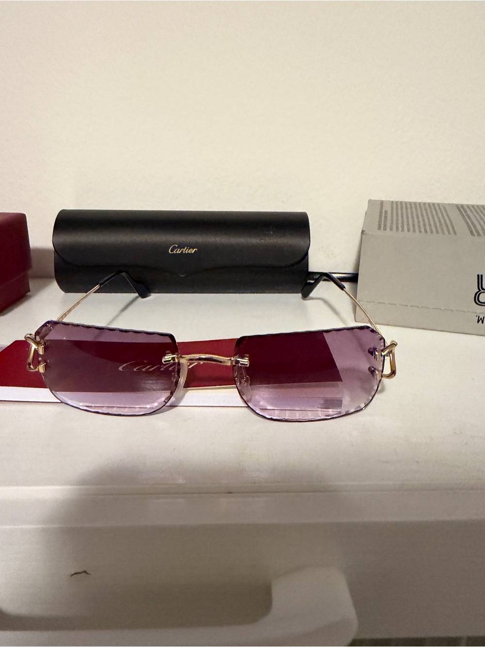 Cartier Women's Rimless Sunglasses with Purple Gradient Lenses and Gold Temples